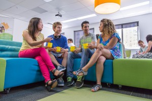 Common room ABILITY students holding cups